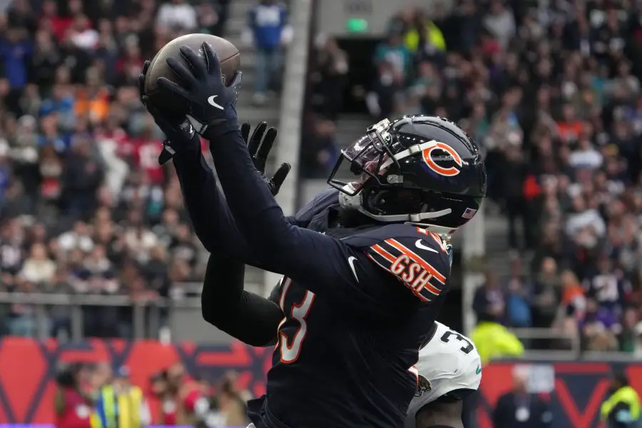 Chicago Bears wide receiver Keenan Allen (13) catches a three-yard touchdown pass against Jacksonville Jaguars cornerback Montaric Brown (30) in the second half during an NFL International Series game at Tottenham Hotspur Stadium