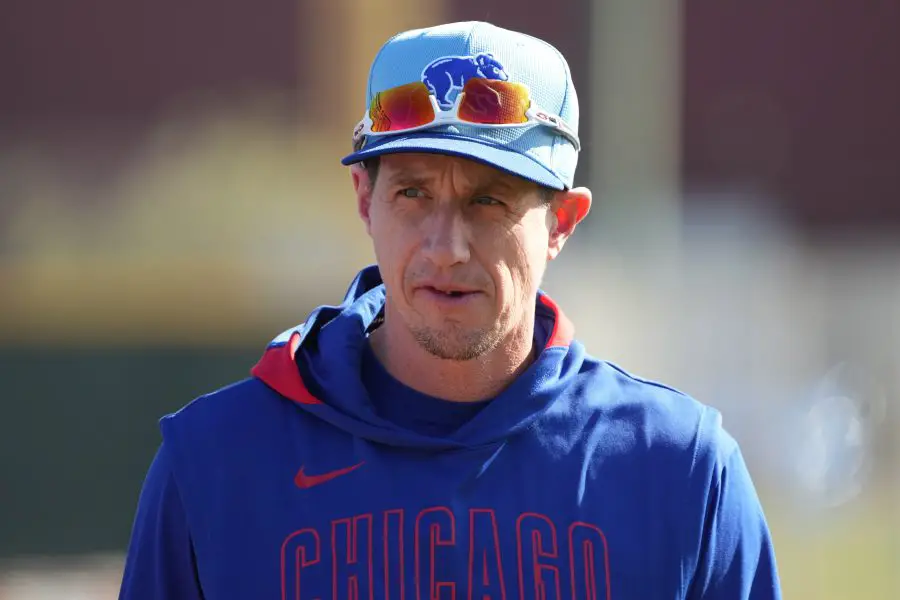 Chicago Cubs manager Craig Counsell (11) watches players warm up during spring training camp.