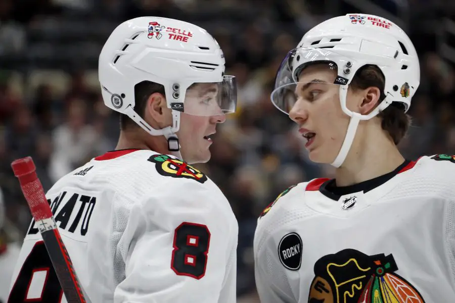 Chicago Blackhawks center Ryan Donato (8) and center Connor Bedard (right) talk before a face-off against the Pittsburgh Penguins