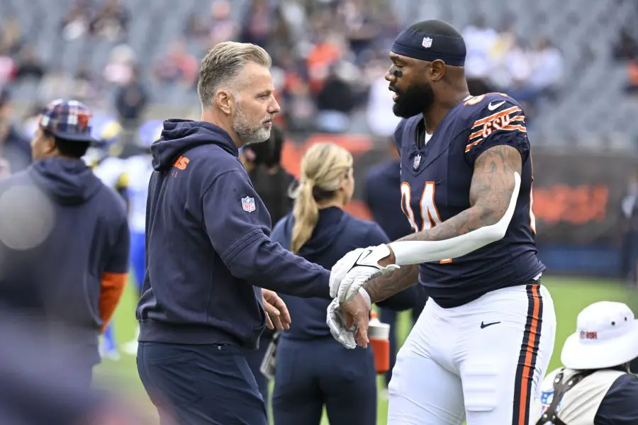 Chicago Bears head coach Matt Eberflus and Chicago Bears tight end Marcedes Lewis (84) before the game against the Los Angeles Rams at Soldier Field.