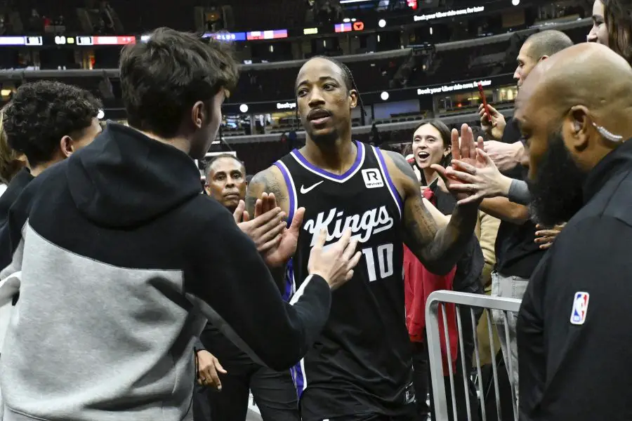 Sacramento Kings forward and former Chicago Bulls player DeMar DeRozan (10) high fives fans after the game against the Chicago Bulls during the second half at United Center.