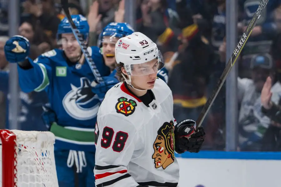 Chicago Blackhawks forward Connor Bedard (98) reacts as Vancouver Canucks forward Nils Aman (88) and forward Teddy Blueger (53) celebrate Aman’s goal in the third period at Rogers Arena.