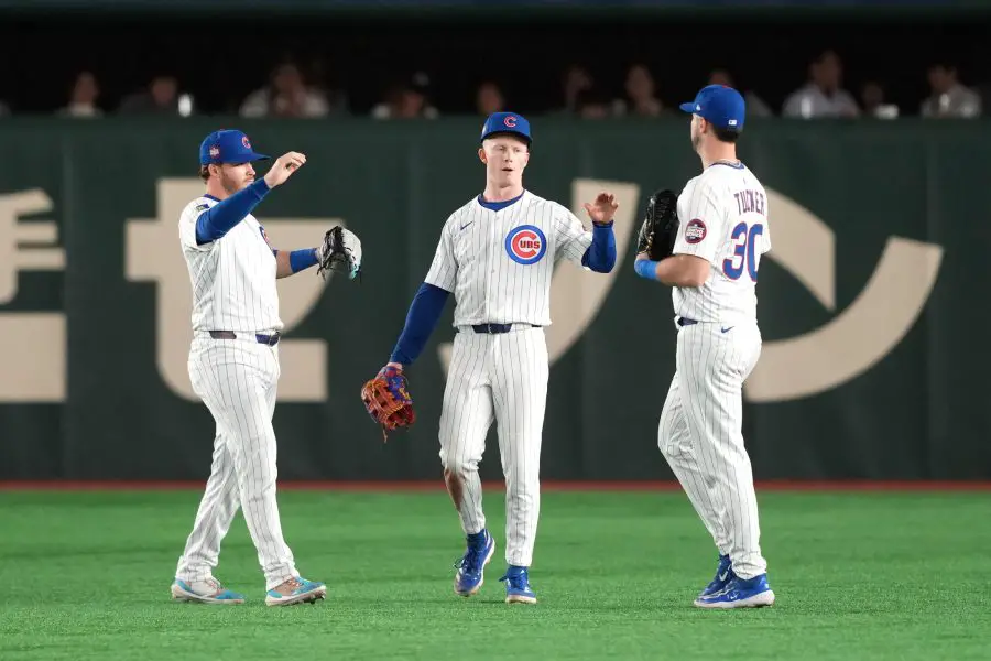 Chicago Cubs center fielder Pete Crow-Armstrong (center) celebrates with right fielder Kyle Tucker (30) and left fielder Ian Happ (left) after defeating the Yomiuri Giants at Tokyo Dome.