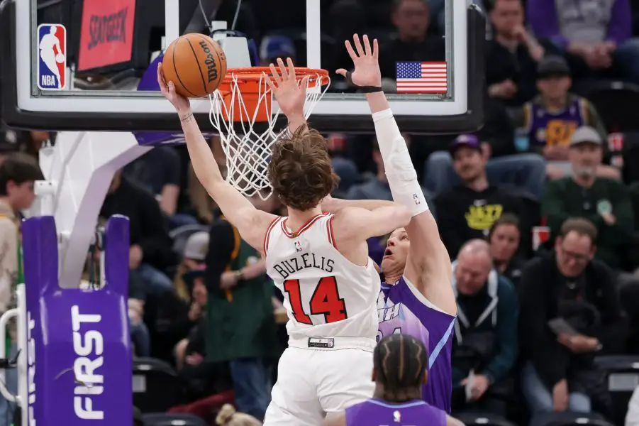 Chicago Bulls forward Matas Buzelis (14) gets past Utah Jazz center Walker Kessler (24) and to the basket during the first quarter at Delta Center.