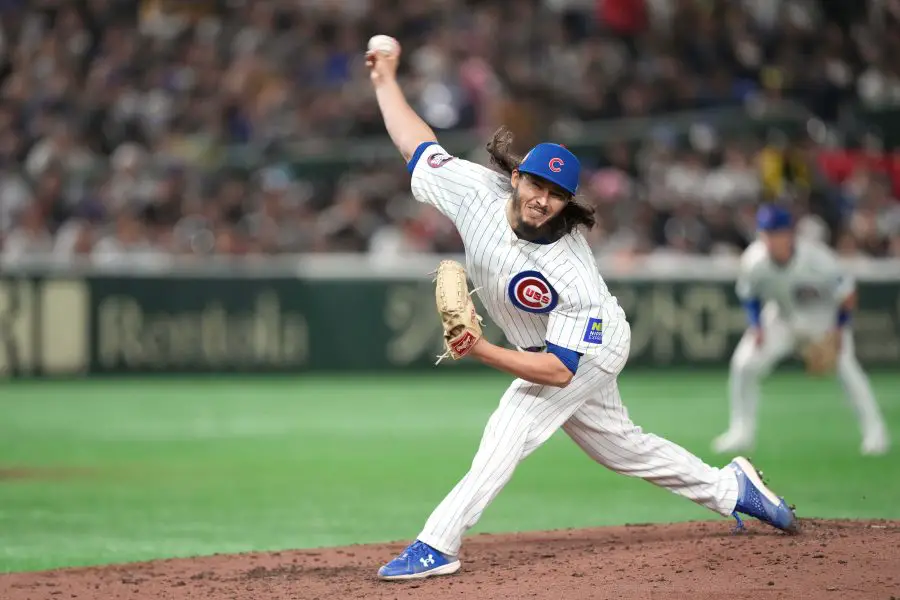 Chicago Cubs pitcher Eli Morgan (33) throws a pitch against the Hanshin Tigers during the fifth inning at Tokyo Dome. 