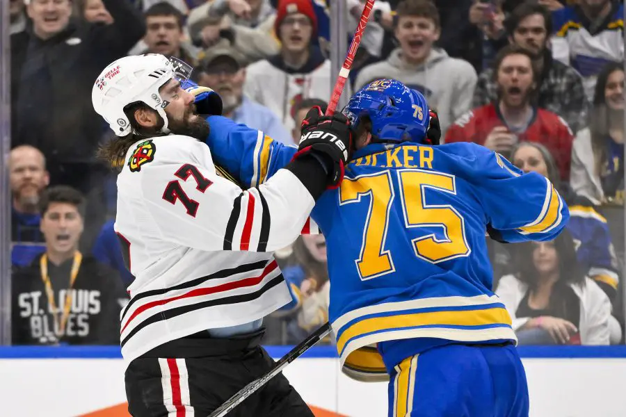 Chicago Blackhawks left wing Patrick Maroon (77) fights St. Louis Blues defenseman Tyler Tucker (75) during the third period at Enterprise Center.